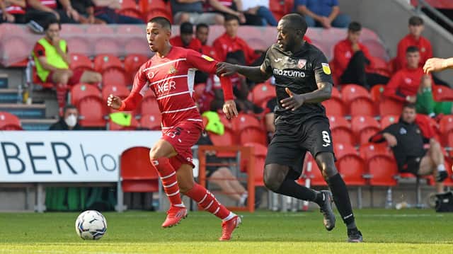 Rodrigo Vilca takes on Morecambe's Toumani Diagouraga. Photo: Andrew Roe/AHPIX LTD