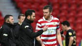 Doncaster Rovers head coach Danny Schofield wants captain Tom Anderson to stay at the club.