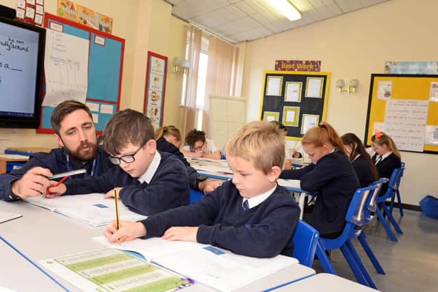 Luke Poppleton, class teacher and Math lead, pictured with KS2 children. Picture: NDFP-12-11-19-DenabyMainPrimary-4