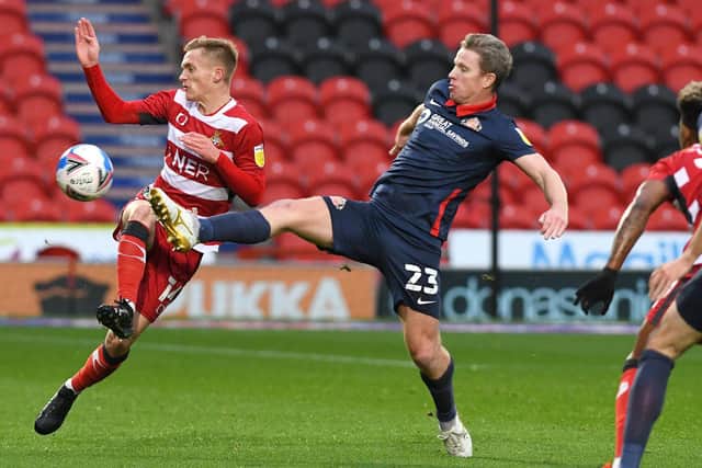 Matt Smith comes under pressure from Sunderland's Grant Leadbitter. Picture: Andrew Roe/AHPIX