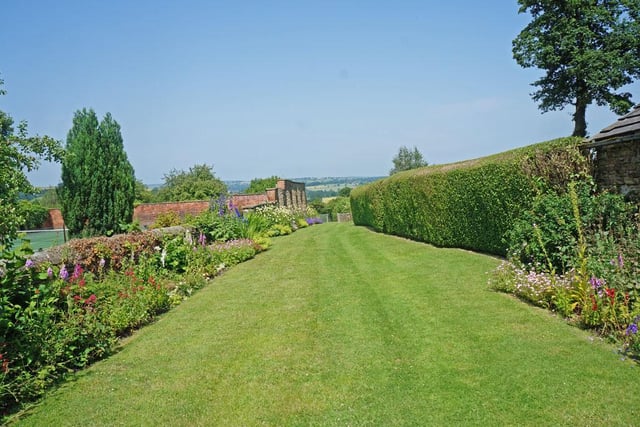 To the rear of the house is a lawned area at the end of which is a hard tennis court and adjacent to that is a kitchen garden and greenhouse.