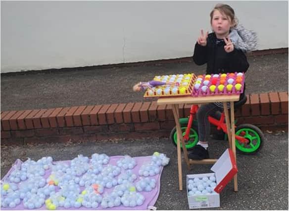 Bobbi has been selling bags of golf balls to help her school.