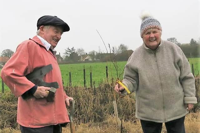Colin and Yvonne Wright pictured planting trees