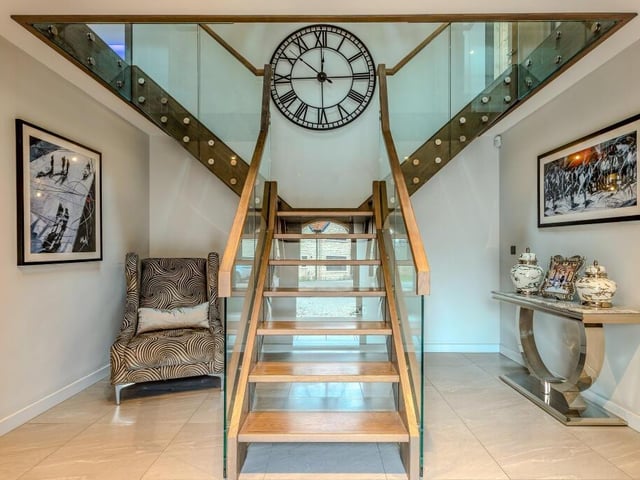 The impressive main hallway with striking staircase.