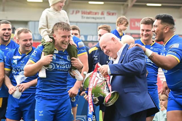 Doncaster chief executive Carl Hall celebrates promotion with the players. (Photo: Howard Roe/AHPIX.com)