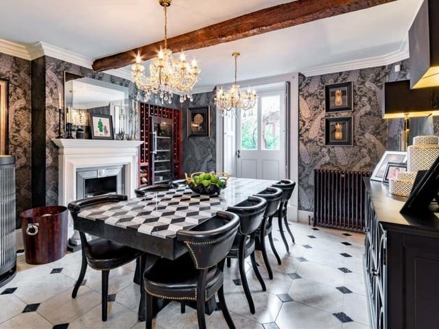 The beamed dining room, with feature fireplace.