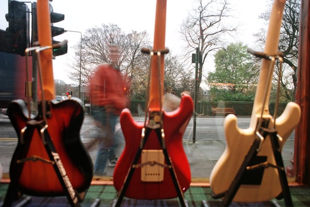 Guitars for sale in the window of Duncanson and Edwards.