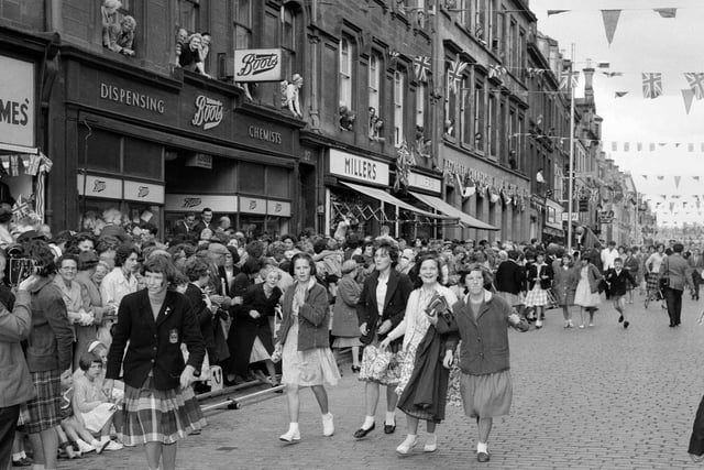 Crowds waiting to greet the Queen and the Duke of Edinburgh on their visit to Hawick in July 1962.