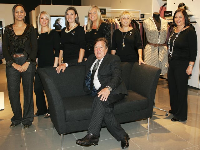 George Davis with some of the staff at his new G IV store in 2010