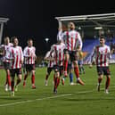 Alex Pritchard celebrates scoring for Sunderland at Shrewsbury.