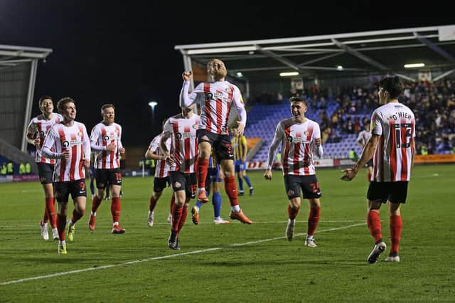 Alex Pritchard celebrates scoring for Sunderland at Shrewsbury.