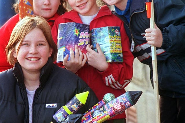 Amy Johnson (12), Becki Coyle (10), Lisa Spurr (10) and Laura Spurr (12) all from Great Houghton, pictured with Chinese fireworks donated by Bakul Popat of Sparklers Chinese Fireworks, Sheffield which were used at a CHildren in Need fundraiser in 1998