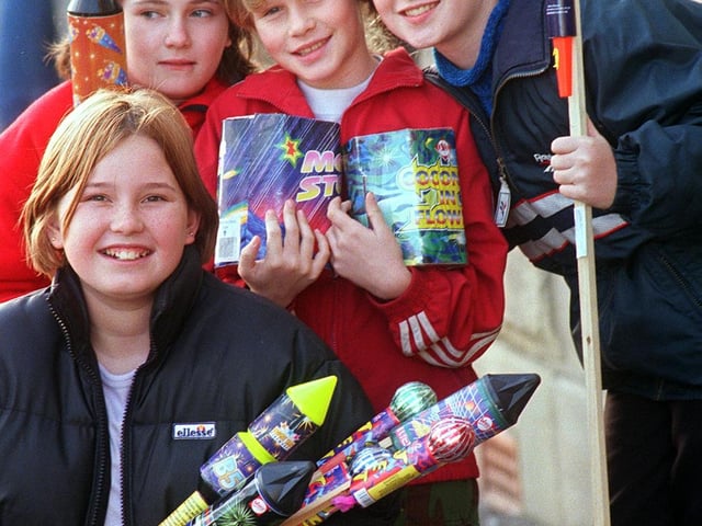 Amy Johnson (12), Becki Coyle (10), Lisa Spurr (10) and Laura Spurr (12) all from Great Houghton, pictured with Chinese fireworks donated by Bakul Popat of Sparklers Chinese Fireworks, Sheffield which were used at a CHildren in Need fundraiser in 1998