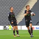 Luke Molyneux celebrates his goal with Joe Ironside.