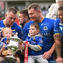 The Dons celebrate winning promotion from League 1. Picture: Howard Roe/AHPIX.com