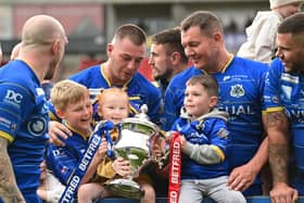 The Dons celebrate winning promotion from League 1. Picture: Howard Roe/AHPIX.com