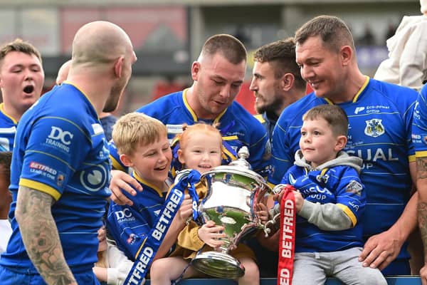 The Dons celebrate winning promotion from League 1. Picture: Howard Roe/AHPIX.com