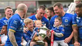 The Dons celebrate winning promotion from League 1. Picture: Howard Roe/AHPIX.com