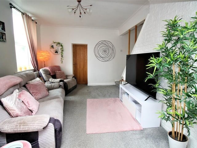 The comfortable lounge area with a staircase to the rear.