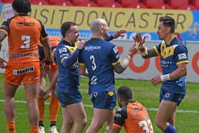 Dons players celebrate Misi Taulapapa's try. Picture: Andrew Roe/AHPIX LTD