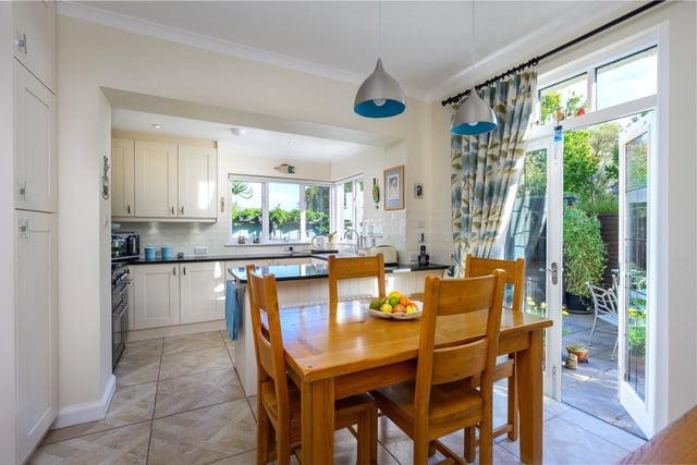 The kitchen includes a breakfast room area with French doors to the terrace.