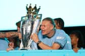 Erling Haaland of Manchester City celebrates with the Premier League trophy during the Manchester City trophy parade in May last year (Photo by Charlotte Tattersall/Getty Images)