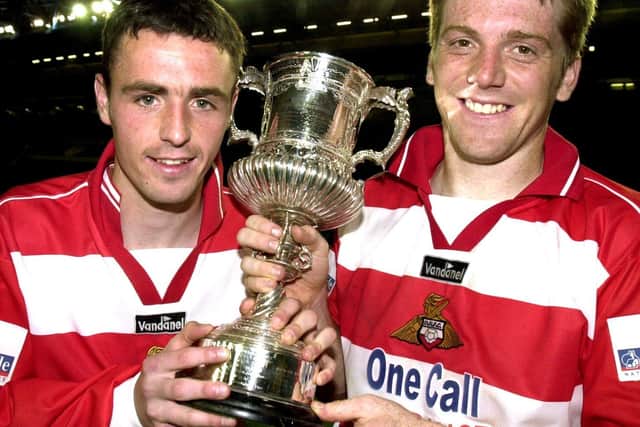 Barry Miller (right) and Andy Watson celebrate winning the Sheffield & Hallamshire FA Senior Challenge Cup against Emley AFC at Hillsborough in 2001.