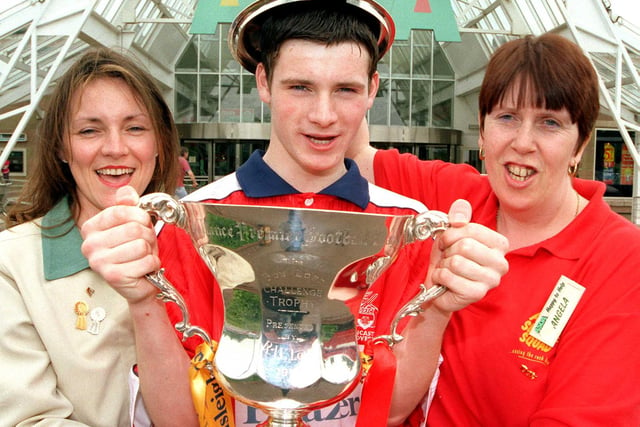 Doncater Asda's Carol Latham, James Maddison, aged 14, and Angela Gray get to hold the Endsliegh Challenge Trophy won by the Doncaster Rovers in 1999
