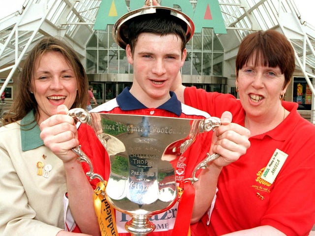 Doncater Asda's Carol Latham, James Maddison, aged 14, and Angela Gray get to hold the Endsliegh Challenge Trophy won by the Doncaster Rovers in 1999