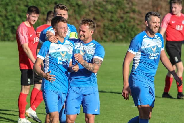 Armthorpe Welfare’s players celebrate a goal in their win at Parkgate. Picture: Steve Pennock