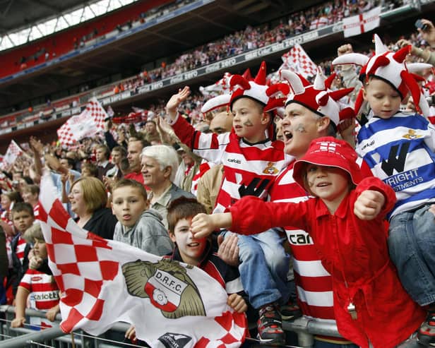 Doncaster Rovers supporters celebrate after beating Leeds United during the Football League One play-off final on May 25, 2008.