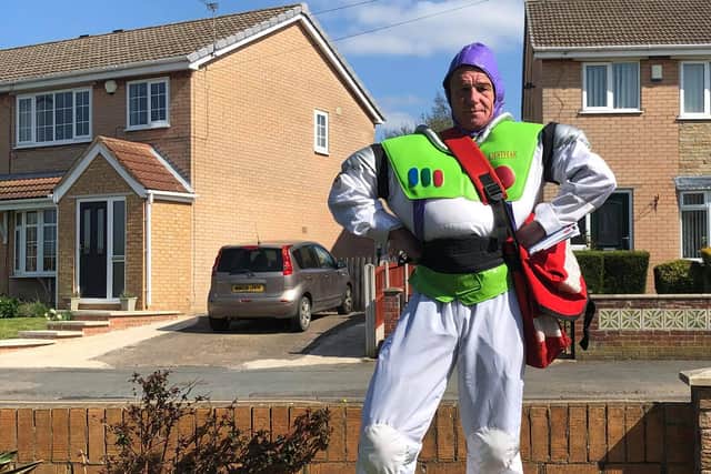 Postman David Evans dressed as Buzz Lightyear