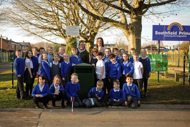 Lea Predley, Armthorpe Parish Council Community Clean-Up Champ, Bitter the Litter Critter Mascot, Andrea Frost, Key Stage One lead and Year Two teacher, pictured with year three children outside Southfield Primary School by the Superbin. Picture: NDFP-18-01-22-SuperBin 1-NMSY