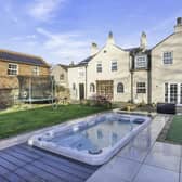 The impressive property has its own heated swim spa pool in the gardens.
