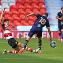Doncaster Rovers' Liam Ravenhill tackles Port Vale's Oliver Arblaster during pre-season.