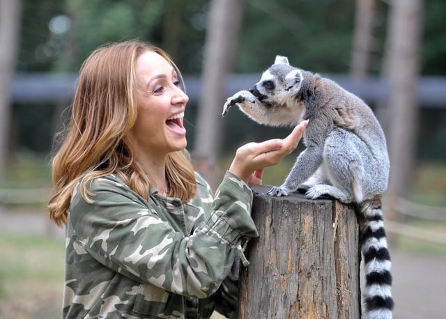 14 August 2018 Actress Lucy Jo Hudson amongst the lemurs during filming the Big Week At the Zoo at Yorkshire Wildlife Park . Picture Tony Johnson.