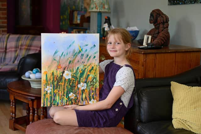 Artist Daisy Watt, 11, pictured with Autumn Treasure. Picture: NDFP-22-09-20-Artist Watt 3-NMSY