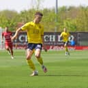 Joe Dodoo takes on Oxford United's Luke McNally.