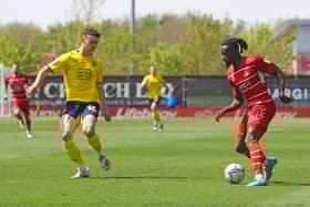 Joe Dodoo takes on Oxford United's Luke McNally.