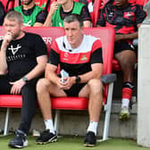 Doncaster Rovers boss Grant McCann (centre) and his assistant Cliff Byrne.