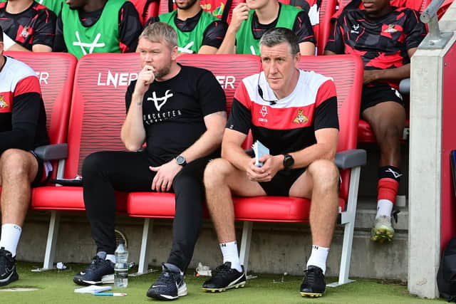 Doncaster Rovers boss Grant McCann (centre) and his assistant Cliff Byrne.