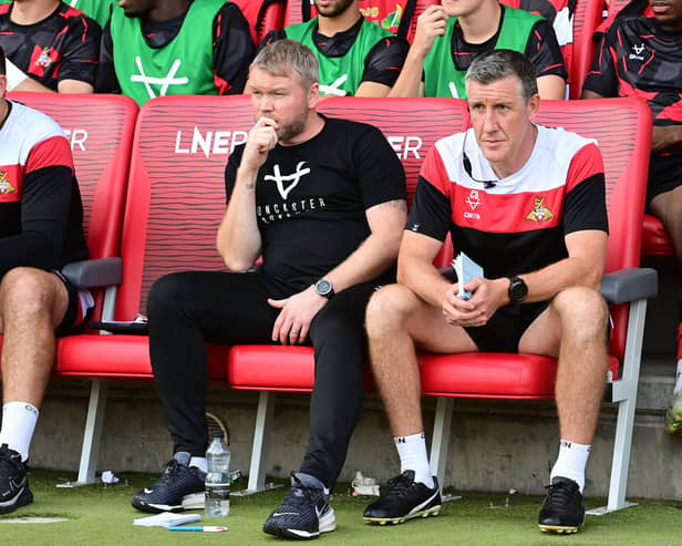 Doncaster Rovers boss Grant McCann (centre) and his assistant Cliff Byrne.