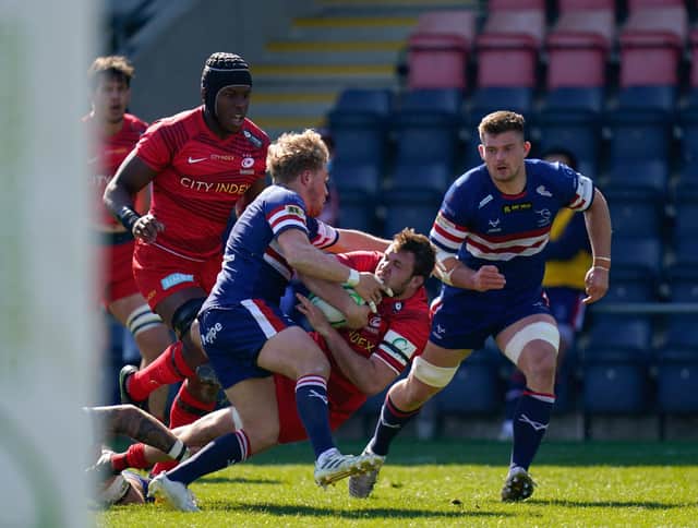 Knights' Gus Warr tackles Saracens' Jamie George during last weekend's Championship clash at Castle Park. Photo: Steve Flynn/AHPIX LTD