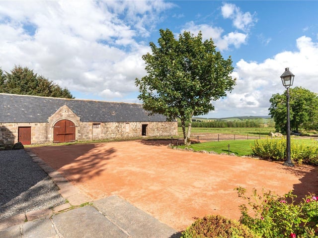 The property's grounds include a listed steading building.