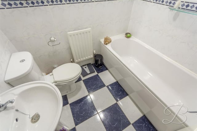 The main bathroom can be found upstairs. It comprises a panelled bath, low-flush WC, pedestal sink, full height tiling and central heating radiator.