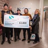 Pictured presenting the cheque for £2,800 to St John’s Hospice Fundraising Manager Tracey Gaughan (right) are (from left to right) Brett Hughes, Chris Hargrave, Kris Noble and Shaun Woodward.
