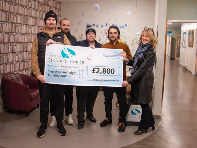 Pictured presenting the cheque for £2,800 to St John’s Hospice Fundraising Manager Tracey Gaughan (right) are (from left to right) Brett Hughes, Chris Hargrave, Kris Noble and Shaun Woodward.