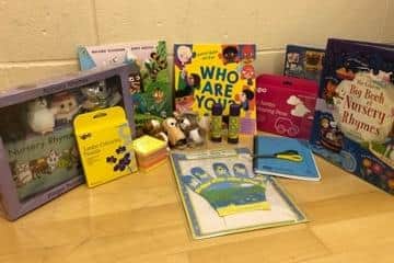A key part of the home visits is sharing books with the family, so they can read together in their own time