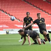 Rayhaan Tulloch fires on goal against MK Dons