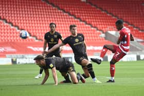 Rayhaan Tulloch fires on goal against MK Dons